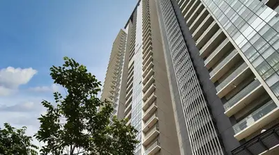 two tall buildings with a tree in front of them at 8 Kuala Lumpur City for 4 to 10 PAX of 4 BEDROOMS and 3 BATHROOMS near KLCC in Kuala Lumpur