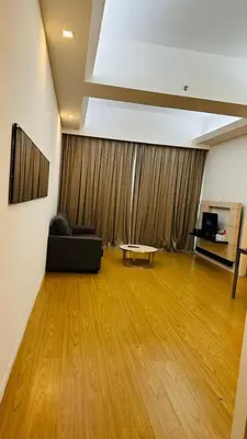 a living room with a couch and a table at SG Residence Kuala Lumpur by Fortune Suites in Kuala Lumpur