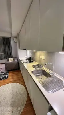 a kitchen with a sink and a counter top at KLCC Apartment in Kuala Lumpur