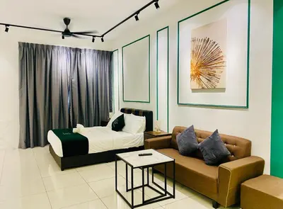 a hotel room with a bed and a couch at Chambers Luxury Suites By Zaff in Kuala Lumpur