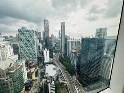 a view of a city from a skyscraper at Vortex suites KLCC by Nadia Guesthouse Kuala Lumpur in Kuala Lumpur