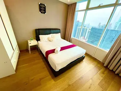 a bedroom with a bed and a large window at Vortex suites KLCC by Nadia Guesthouse Kuala Lumpur in Kuala Lumpur
