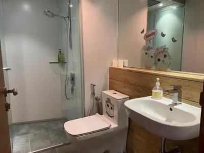 a bathroom with a sink and a toilet and a shower at Vortex suites KLCC by Nadia Guesthouse Kuala Lumpur in Kuala Lumpur