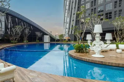 a large swimming pool in a city with buildings at Blue cozy duplex house in Kuala Lumpur