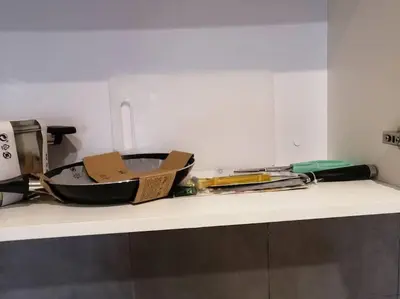 a counter top with a bunch of kitchen utensils at IndoChina 3BR MVertica near MRT by RumaBnB in Kuala Lumpur