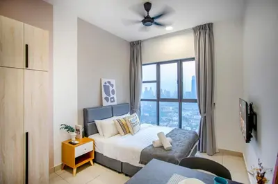 a bedroom with a bed and a large window at Trion Residence KL near TRX, MyTown, Ikea Cheras, Pudu in Kuala Lumpur