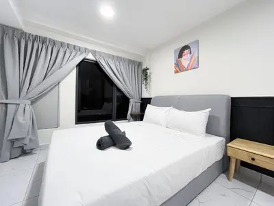 a bedroom with a white bed and a window at Arte Cheras Kuala Lumpur in Kuala Lumpur