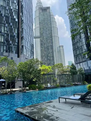 a swimming pool in a city with tall buildings at Star Residence By M&T in Kuala Lumpur