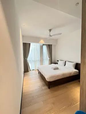 a bedroom with a bed and a large window at Star Residence By M&T in Kuala Lumpur
