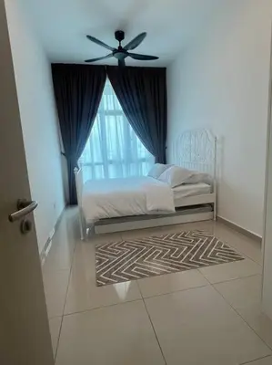 a bedroom with a bed and a ceiling fan at Legasi High floor 3 BR KLCC view in Kuala Lumpur