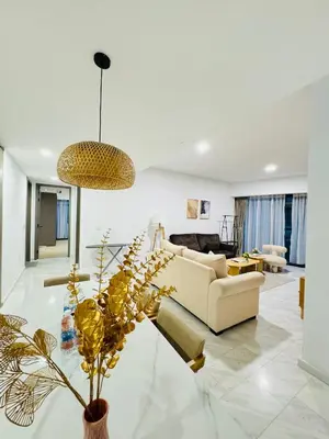 a living room with a couch and a table at Eaton Service Apartment at KLCC in Kuala Lumpur