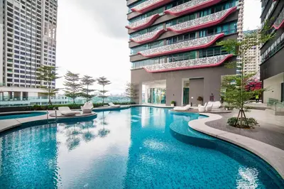 a large swimming pool in front of a building at Arte Plus Ampang Free Parking in Kuala Lumpur