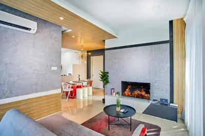 a living room with a couch and a fireplace at Arte Plus Ampang Free Parking in Kuala Lumpur