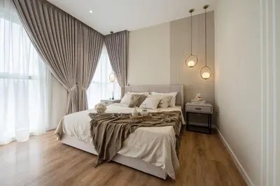 a bedroom with a large bed and a large window at NaiBnB in Quill Residences in Kuala Lumpur
