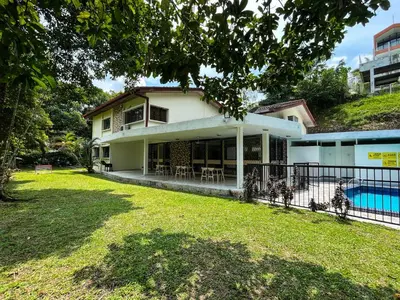 a house with a yard and a swimming pool at Bukit Tunku Grande Villa by uBook in Kuala Lumpur