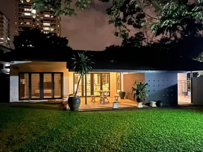 a house with a green lawn in front of it at KL PJ Garden Pool Villa Karaoke in Petaling Jaya