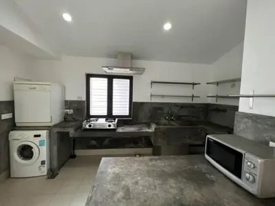 a large kitchen with a sink and a window at KL PJ Garden Pool Villa Karaoke in Petaling Jaya
