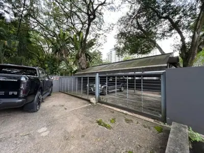a car parked in a parking lot next to a garage at KL PJ Garden Pool Villa Karaoke in Petaling Jaya
