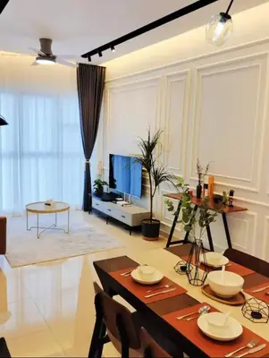 a living room with a table and a television at Trion KL Premium Suite in Kuala Lumpur