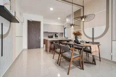 a kitchen and dining room with a table and chairs at M Vertica Cheras by Xuites - 7 pax - Free Netflix - MRT at 500m - 15 mins to KLCC & TRX in Kuala Lumpur