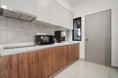 a kitchen with a counter top with a microwave at M Vertica Cheras by Xuites - 7 pax - Free Netflix - MRT at 500m - 15 mins to KLCC & TRX in Kuala Lumpur