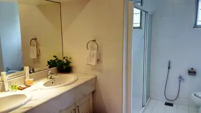 a bathroom with a sink and a shower at 5 Twenty @ Ampang Hilir in Kuala Lumpur