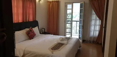 a bedroom with a bed with a keyboard on it at 5 Twenty @ Ampang Hilir in Kuala Lumpur