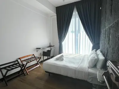 a bedroom with a bed and a large window at OPUS Kuala Lumpur by Scape Stay in Kuala Lumpur
