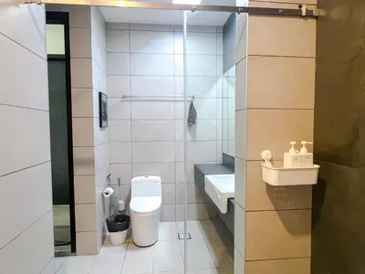 a small bathroom with a toilet and a sink at OPUS Kuala Lumpur by Scape Stay in Kuala Lumpur