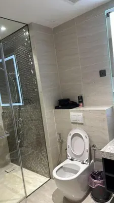 a bathroom with a shower and a toilet and a shower at Star Residence KLCC By M&T in Kuala Lumpur