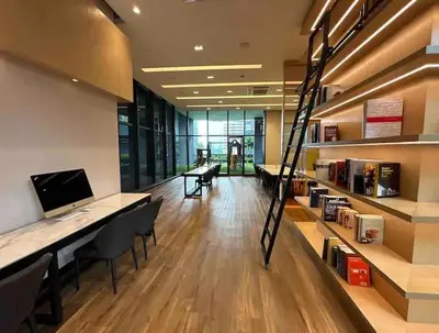 an office with a library with a desk with a computer at Star Residence KLCC By M&T in Kuala Lumpur