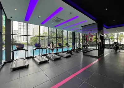 a gym with rows of cardio machines in a building at Star Residence KLCC By M&T in Kuala Lumpur