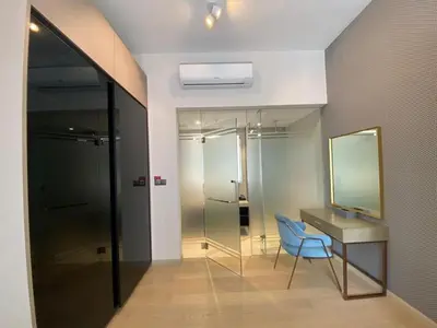 a room with a desk and a blue chair at Star Residence KLCC By M&T in Kuala Lumpur