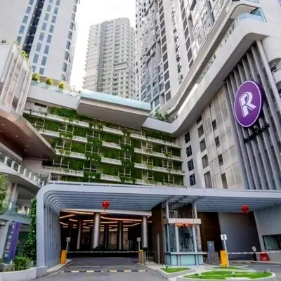 a building with a purple sign in front of it at Pool Haven Reservations in Kuala Lumpur