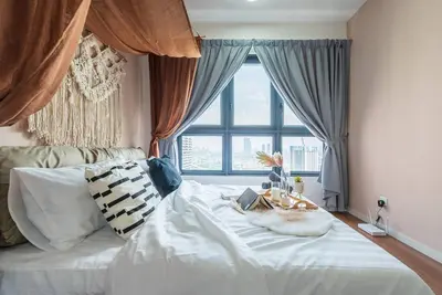 a bedroom with a white bed with a window at MVB36#Bali Style 3 Rooms Family Suite M Vertica Velocity Mall Cheras in Kuala Lumpur