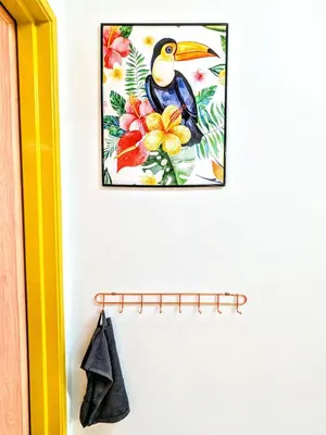 a picture of a bird hanging on a wall at Private Room with Bathroom in Kuala Lumpur