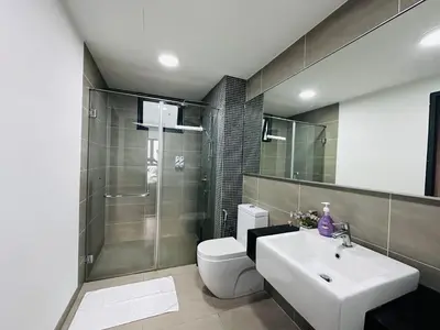a bathroom with a toilet and a sink and a shower at V Residence Suites-27 in Kuala Lumpur
