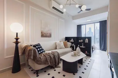 a living room with a couch and a table at NaiBnB in The Colony by Infinitum in Kuala Lumpur