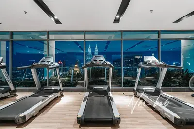 a gym with a view of the city at NaiBnB in The Colony by Infinitum in Kuala Lumpur