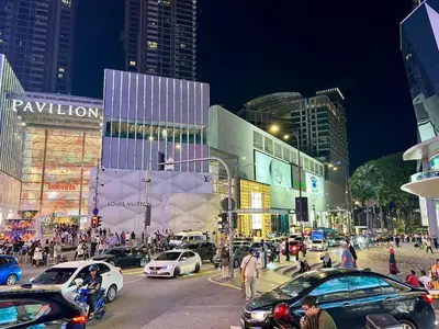 a busy city street at night with cars and people at Dorsett 2BR 6Pax Pavilion Bukit Bintang TRX KLCC in Kuala Lumpur
