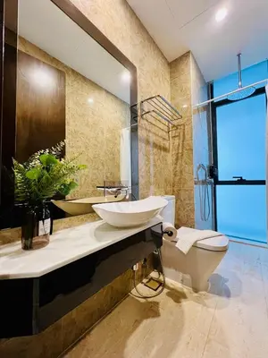 a bathroom with two sinks and a toilet at Dorsett 2BR 6Pax Pavilion Bukit Bintang TRX KLCC in Kuala Lumpur