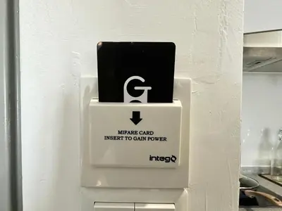 a cell phone sitting on top of a refrigerator at M Vertica, Sunway Velocity Kuala Lumpur by Rverse Suite in Kuala Lumpur