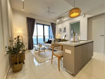 a living room with a kitchen and a living room with a couch at Trion Kuala Lumpur in Kuala Lumpur