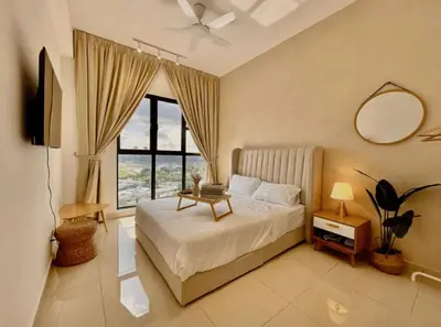 a bedroom with a bed and a large window at Trion Kuala Lumpur in Kuala Lumpur
