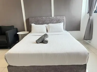 a large white bed in a room at Chambers Residence by Gloria Homes in Kuala Lumpur