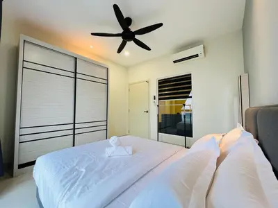 a bedroom with a bed with a ceiling fan at Arte Mont Kiara by DeUrban in Kuala Lumpur