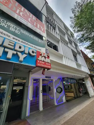 a building with a sign on the side of it at Space Hotel KL Sentral in Kuala Lumpur