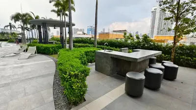 a concrete sink and stools in a park at Premium Skyscraper 1 Bedroom Suite in KL 1-3pax in Kuala Lumpur
