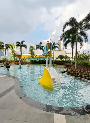a pool at a resort with a slide at Premium Skyscraper 1 Bedroom Suite in KL 1-3pax in Kuala Lumpur