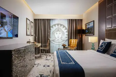 a hotel room with a large bed and a desk at HOME STYLE at Platinum Suites 2 KLCC Twin Towers in Kuala Lumpur
